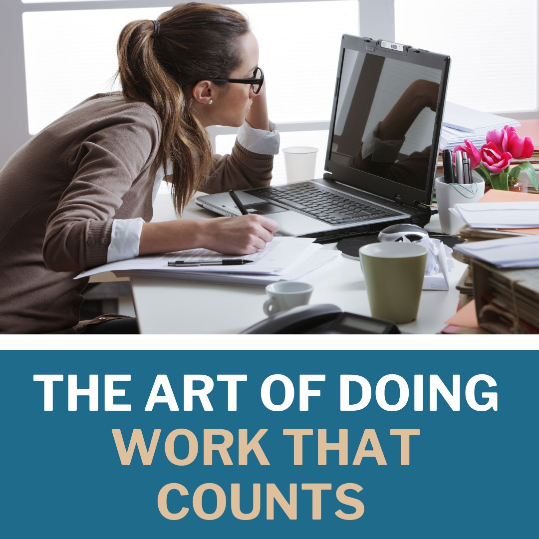The Art of Work That Counts - woman working hard at laptop with pen in hand